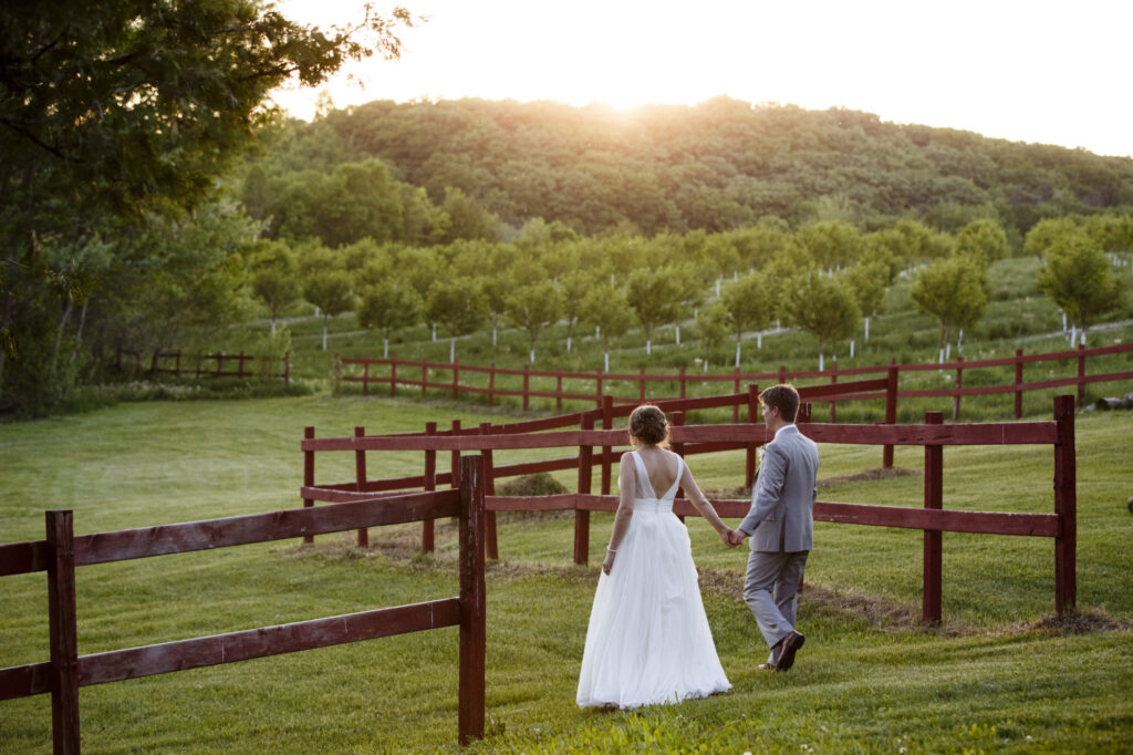 Starry Night Barn and Studios Wedding couple in field