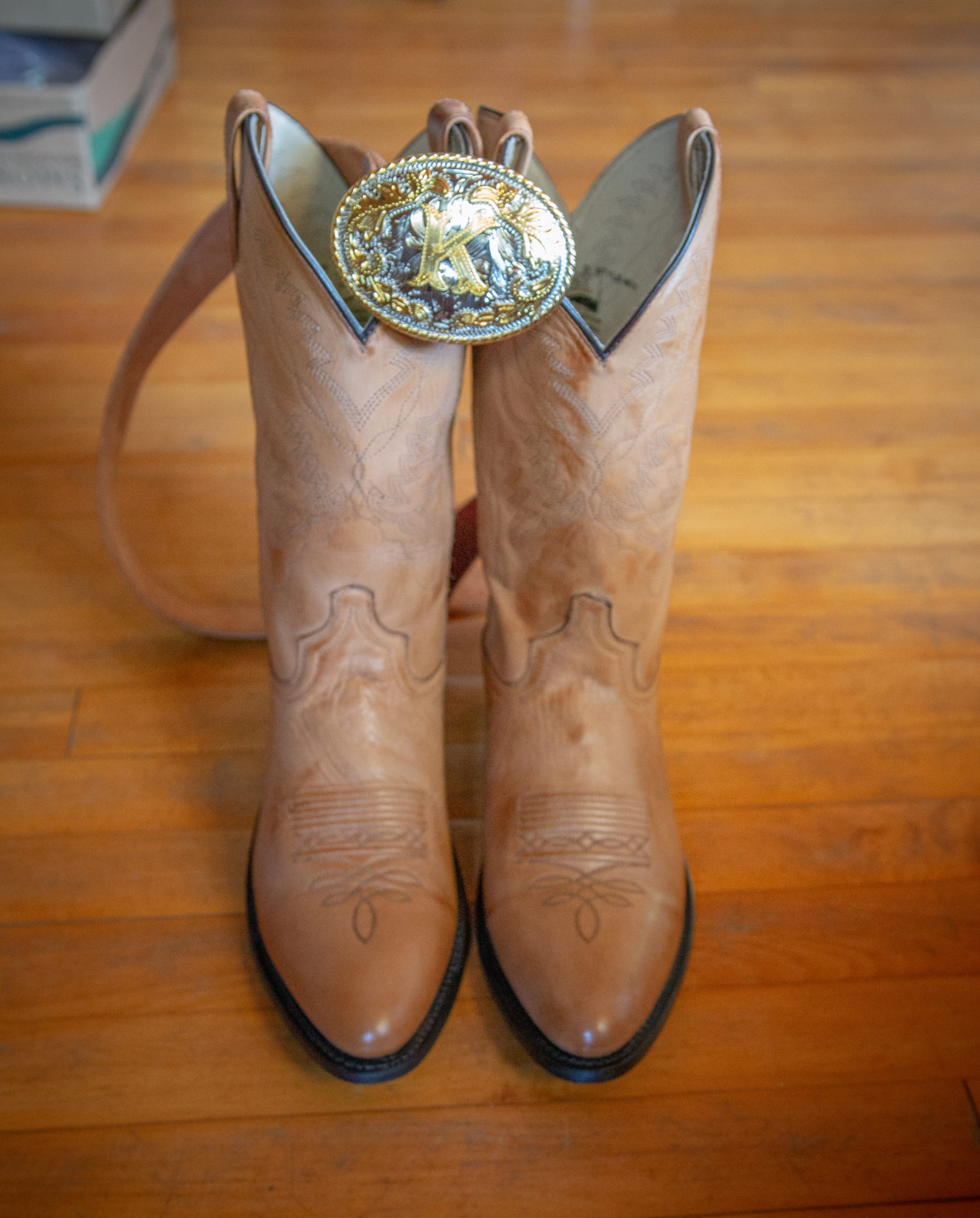 Boots and belt at Starry Night Barn and Studios Wedding