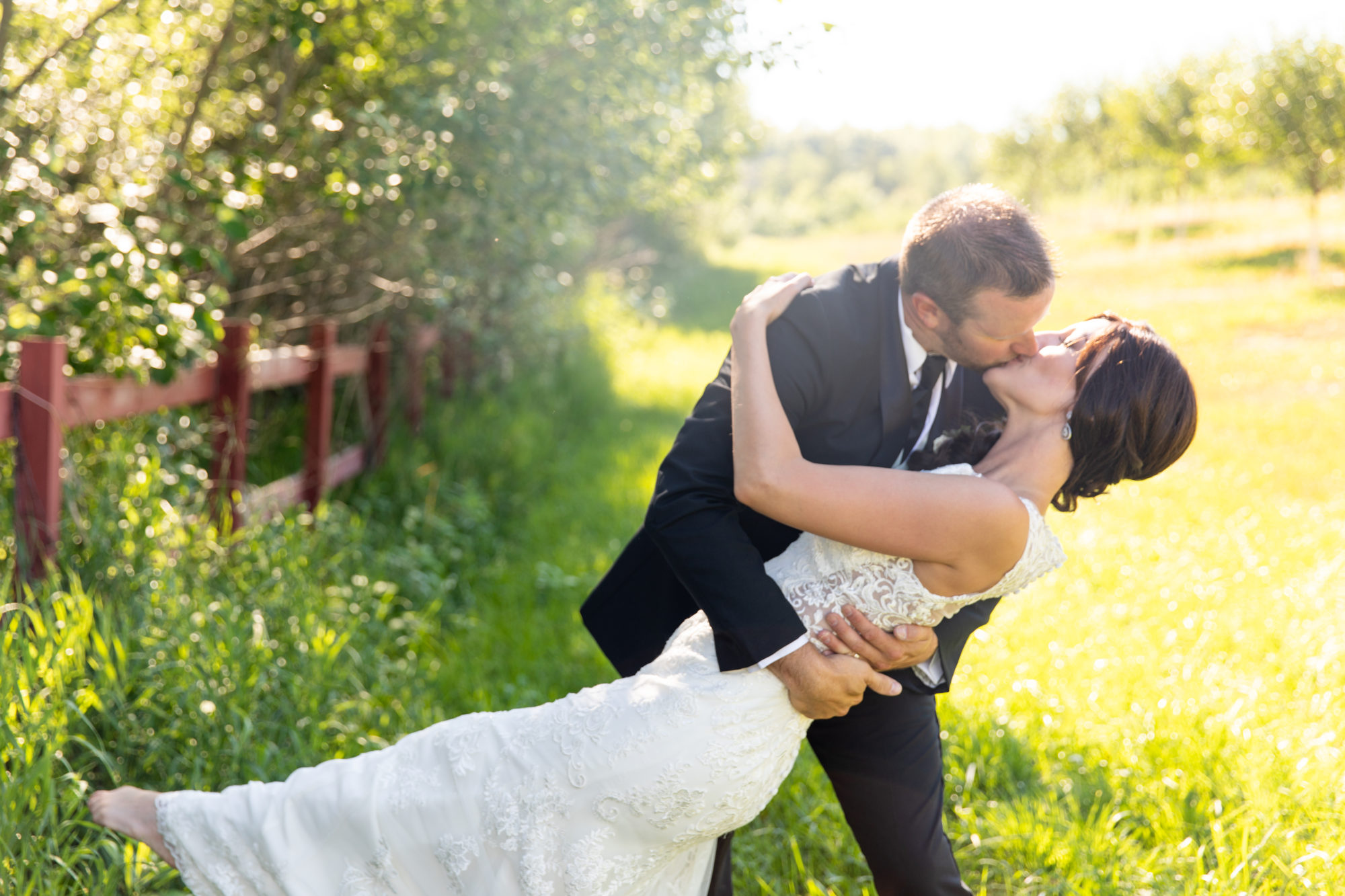 Married couple kiss at Starry Night Barn and Studios Wedding